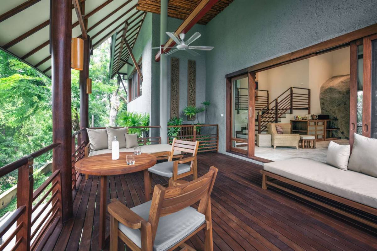 The wooden terrace of one of the garde view villas at Kamalaya